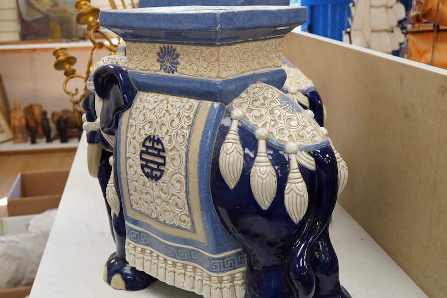 A pair of Chinese glazed earthenware 'elephant' stands, 42.5cm
